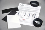Black velcro straps and thermoplast instructions on a gray surface